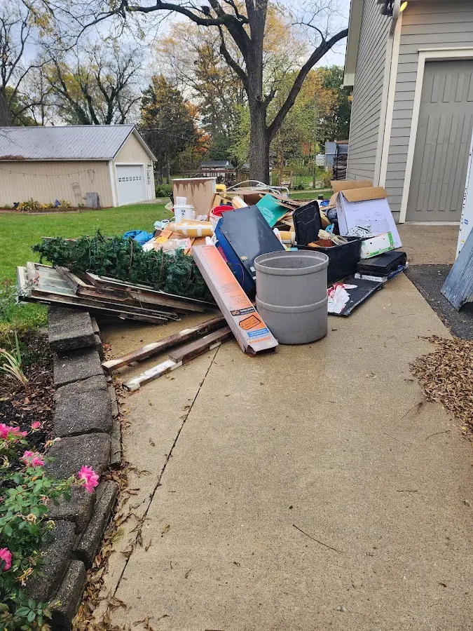Dumpster being loaded with debris for 30 Yard Dumpster Rental in Corry